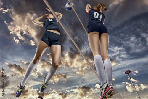  Female volleyball players jumping close-up
