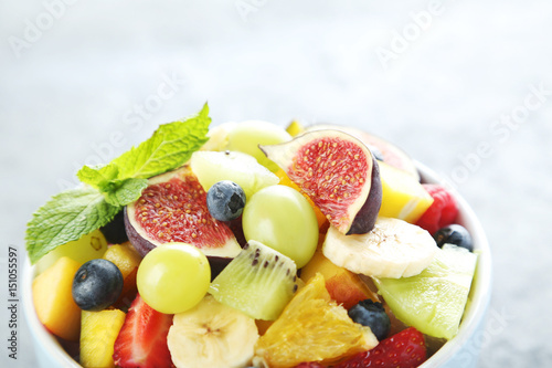 Fresh fruit salad on a grey wooden table