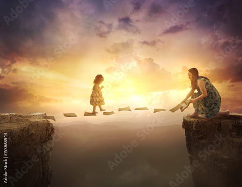 Child walking on pages over cliff