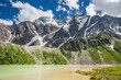 Small glacier Donguzorun lake with mountains on the horizon Small glacier Donguzorun lake with mountains on the horizon