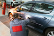 Man using car color meter to check color shade of car. Selective focus on hand. Man using car color meter to check color shade of car. Selective focus on hand.