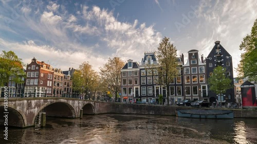 Amsterdam city skyline sunset timelapse at canal waterfront, Amsterdam, Netherlands, 4K Time Lapse