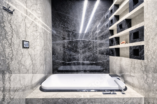  Black-and-white marble in the interior of a modern bathroom in a luxury apartment.