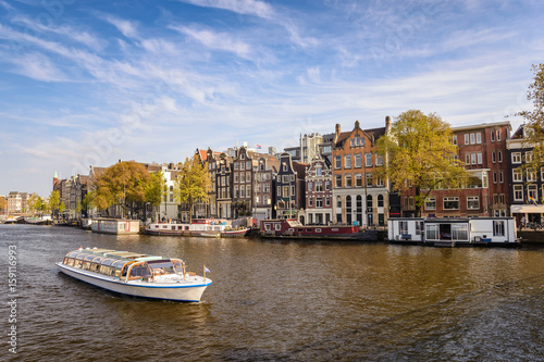Amsterdam city skyline at canal waterfront, Amsterdam, Netherlands