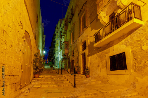  Valletta. Old medieval street at night.