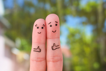 Fingers art of Happy couple showing thumbs up. 