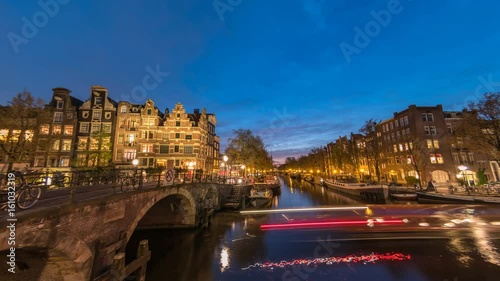 Amsterdam city skyline night timelapse at canal waterfront, Amsterdam, Netherlands, 4K Time Lapse