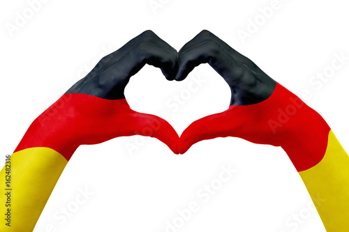 Plakat Ręce flaga Niemiec, kształt serca. Pojęcie kraju symbol, odizolowywający na bielu.
