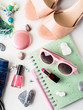 Summer color lifestyle woman clothes flat lay with accessories, make up and sandals Summer color lifestyle woman clothes flat lay with accessories, make up and sandals