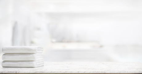  panorama shot : Towels on marble top table with copy space on blurred bathroom background. For product display montage.