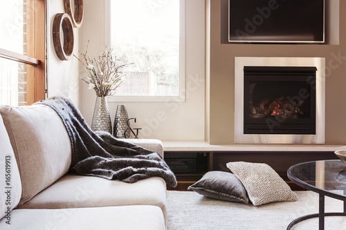 Warm inviting interior with gas log fireplace © Jodie Johnson