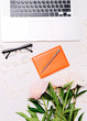 Workplace with laptop glasses notebook pen peonies Workplace with laptop glasses notebook pen peonies