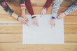 Three women sitting at a desk, together. Three women sitting at a desk, together.