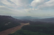 View from the mountain. Back background of nature. Valley in the mountains. Evening landscape. Partly cloudy. Fields and forests from a bird's eye view. Summer. Nature. Crimea. On the Sunset. View from the mountain. Back background of nature. Valley in the mountains. Evening landscape. Partly cloudy. Fields and forests from a bird's eye view. Summer. Nature. Crimea. On the Sunset.