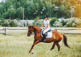 Girl jockey riding a horse