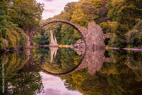 Fototapeta Rakotz Bridge - Optical Illusion with Reflection.