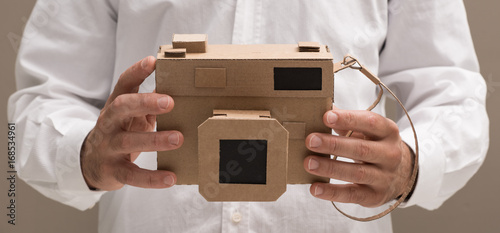 Photographer holding a cardboard camera