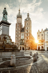 Adam Mickiewicz monument and St. Mary's Basilica on Main Square in Krakow, Poland