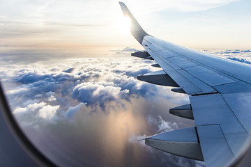 view to the cloudscape from airplane window 