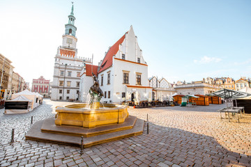 View on the Market square with Mars fountain and city hall during the morning light in Poznan in Poland