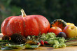 pumpkin and various fruits - apples and plums on a wooden table. pumpkin and various fruits - apples and plums on a wooden table.