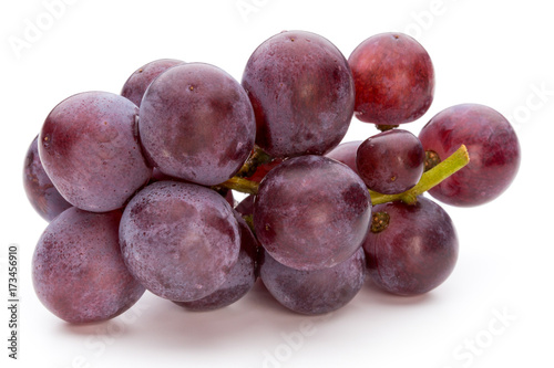 Ripe red grape isolated on white.