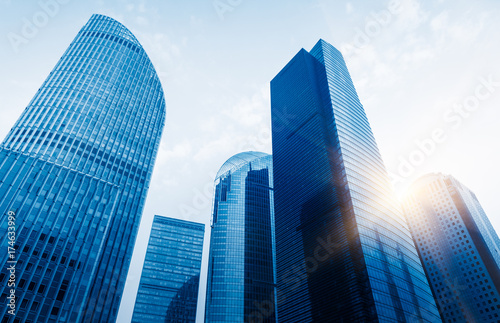 directly below of modern financial skyscrapers in central Hong Kong,blue toned,china.