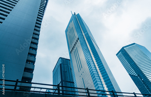 directly below of modern financial skyscrapers in central Hong Kong,blue toned,china.