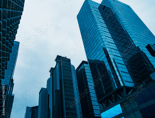 directly below of modern financial skyscrapers in central Hong Kong,blue toned,china.