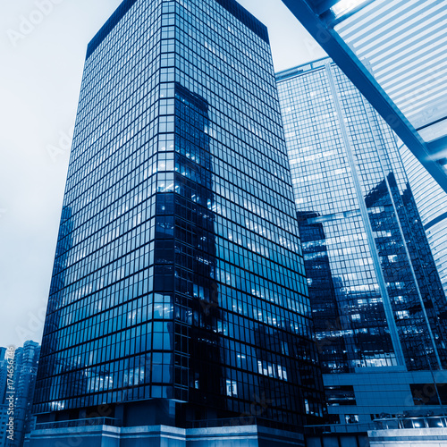directly below of modern financial skyscrapers in central Hong Kong,blue toned,china.