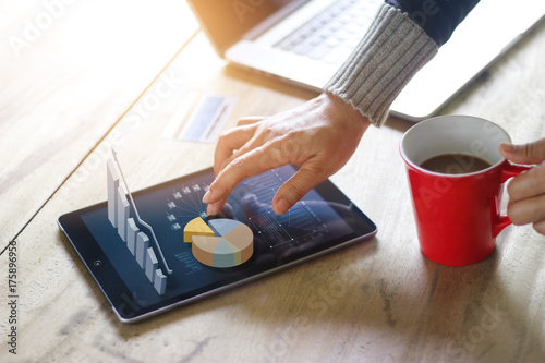 Business people using laptop and tablet for technology e-comerce internet global network connection marketing purchasing and business statistic growth graph, business success concept