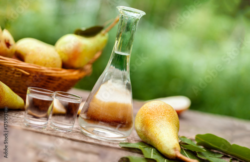 Pears and bottle with pear brandy