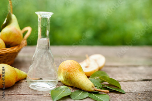 Pear brandy in bottle with pears