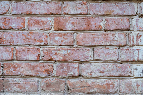 Old wall of red briks tiled background, regular block texture. Wallpaper of ordinary building. Background