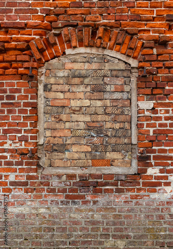 Old bricks wall texture with window.