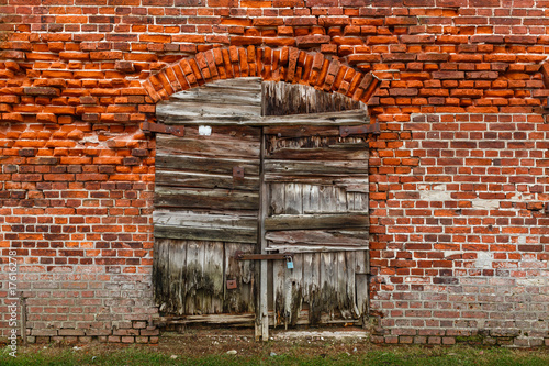 Old bricks wall texture with doors.