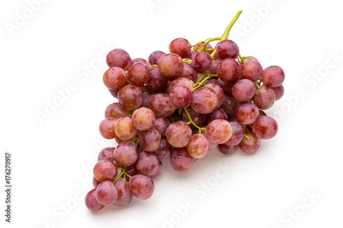 Ripe red grape isolated on white.