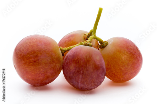 Ripe red grape isolated on white.
