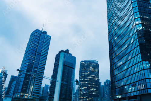 directly below of modern financial skyscrapers in central Hong Kong,blue toned,china.