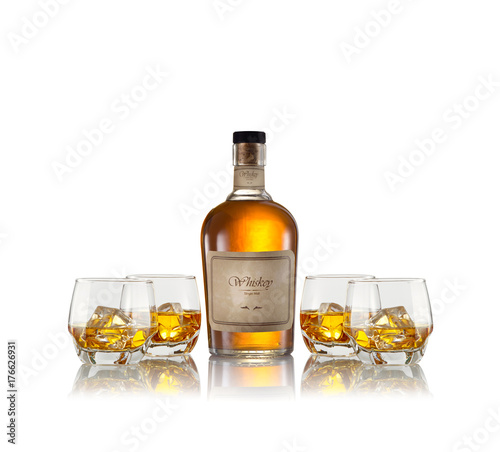 close up view of glasses with ice and whiskey and a bottle aside. self made label.