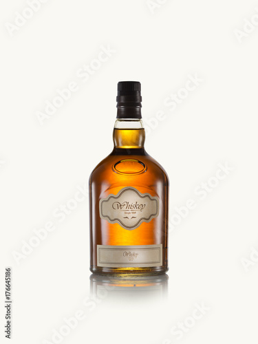 close up view of whiskey bottle on white back. self made label.