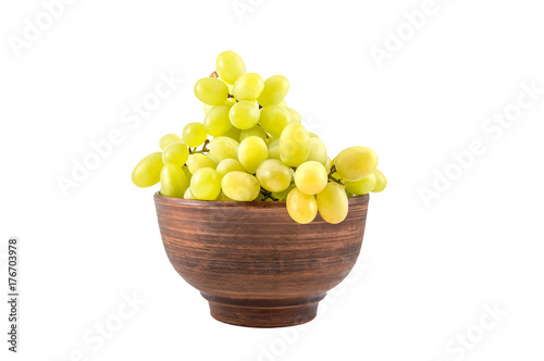 Bowl with ripe green grapes isolated on white background.