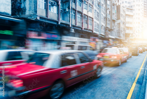 taxi on city street,hong kong,china,asia.