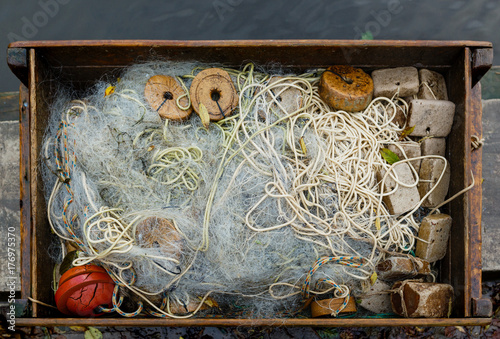 Fishing net in a wooden box.