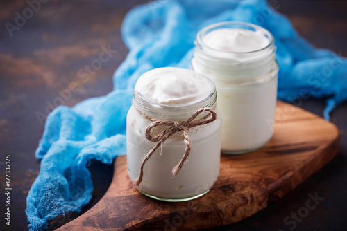 Natural greek yoghurt in glass jars. 