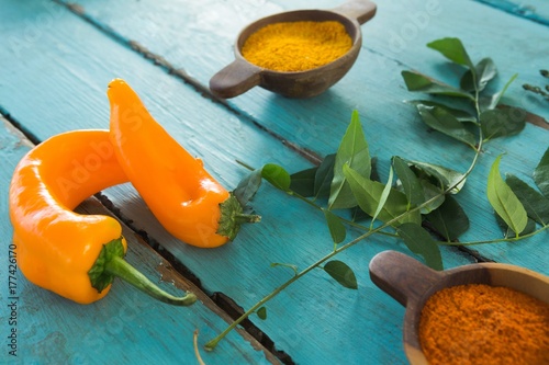Various spices and herbs on wooden table