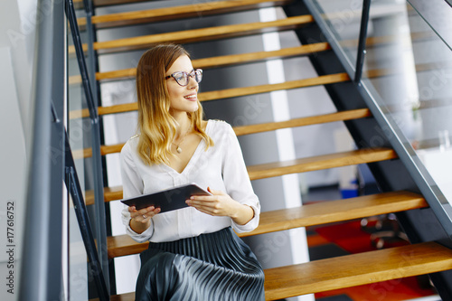 Young woman with tablet in the office