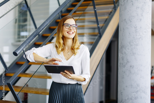 Young woman with tablet in the office