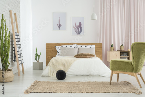 Green retro chair in bedroom