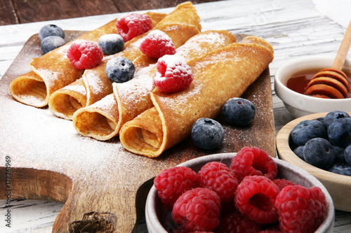 Delicious Tasty Homemade crepes or pancakes with raspberries and blueberries